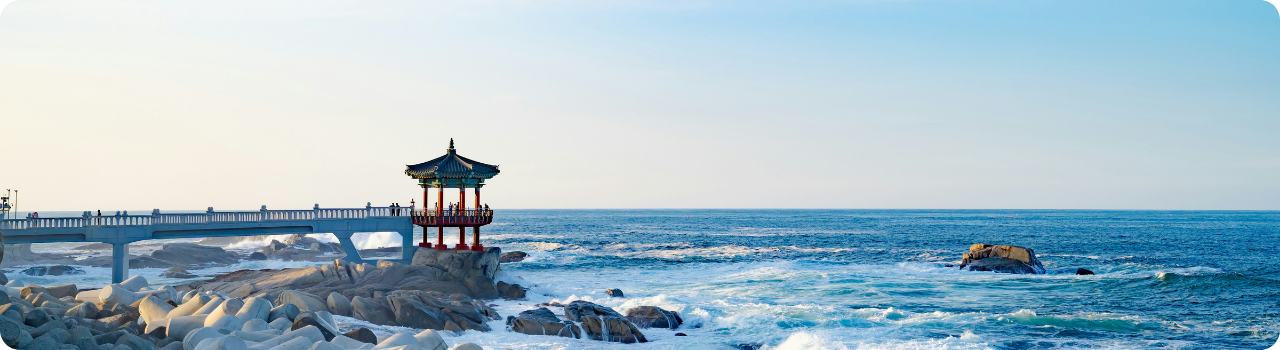 Korean coastal pavilion above breaking waves — the country now listing its own semiconductor ETF in New York.